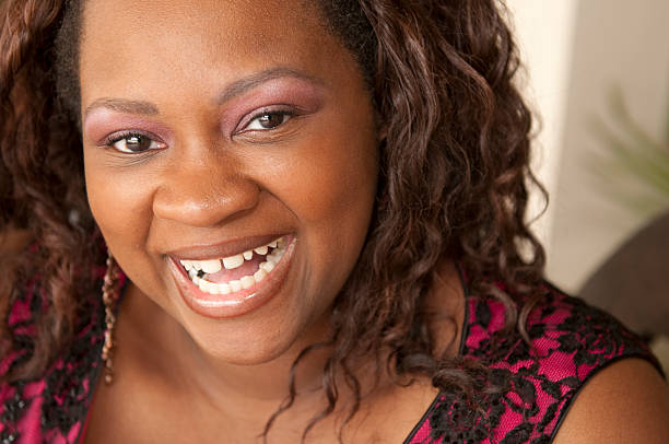 A beautiful African American woman in her 30s with a great smile.