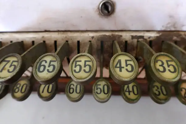 The keys of a very old cash register.