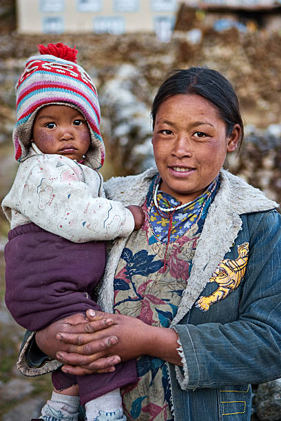 istock Nepali woman with her baby 183884940