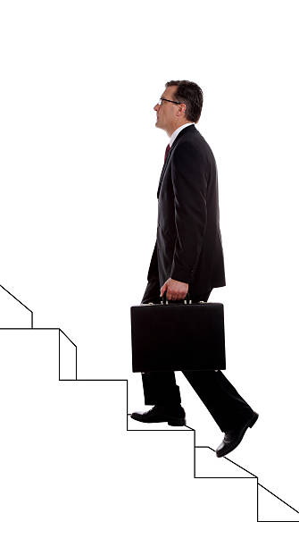 istock Businessman Climbing Drawn Stairs on White 183885040