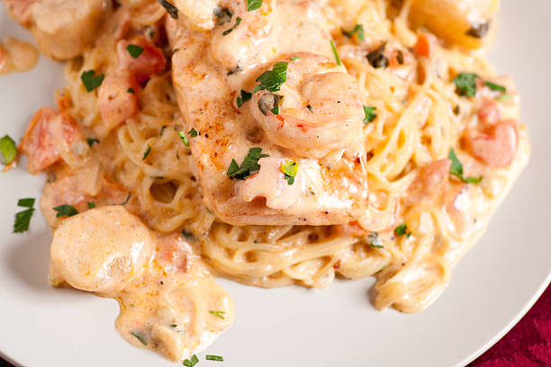 Fresh salmon scallops and shrimp pan seared in a garlic scampi sauce over angel hair pasta.
