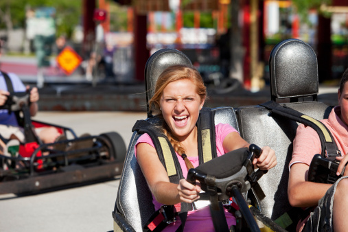 Teenage girl, 15 years, riding go-cart
