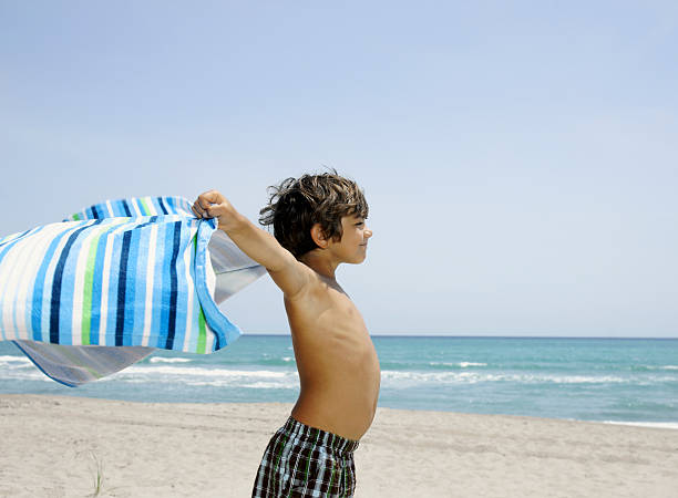 istock Child happy at the beach 183886436