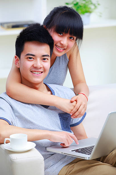 istock picture of young couple in sofa using internet 183887500