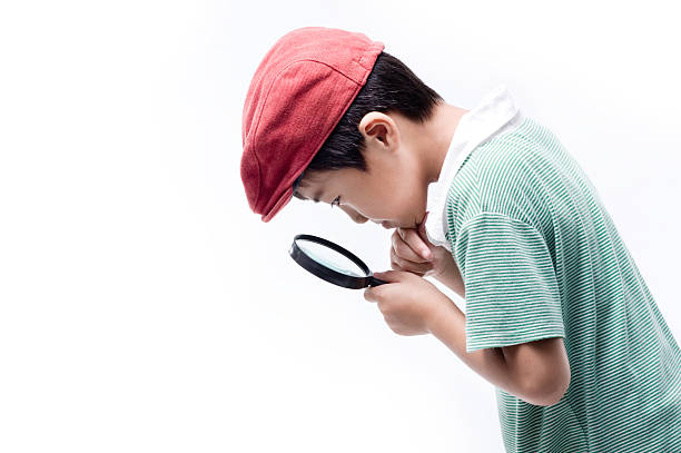 Little boy using magnifying glass Little boy using magnifying glass 9 stock pictures, royalty-free photos & images