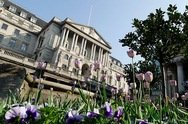 Bank of England, Spring, London Spring tulips bloom in front of the imposing facade of the Bank of England on Threadneedle Street in the City of London. bank of england stock pictures, royalty-free photos & images