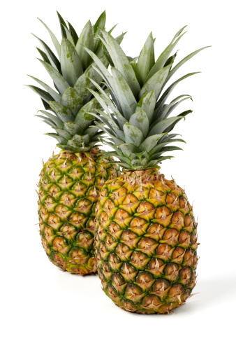 2 pineapples isolated on white background, larger files come with path.