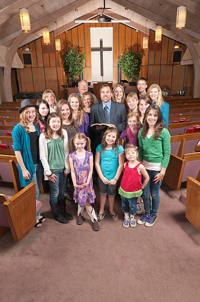 istock Pastor with His People in Church 183889612
