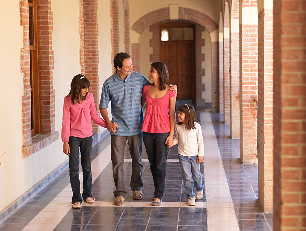 istock Young family walking together 183889789