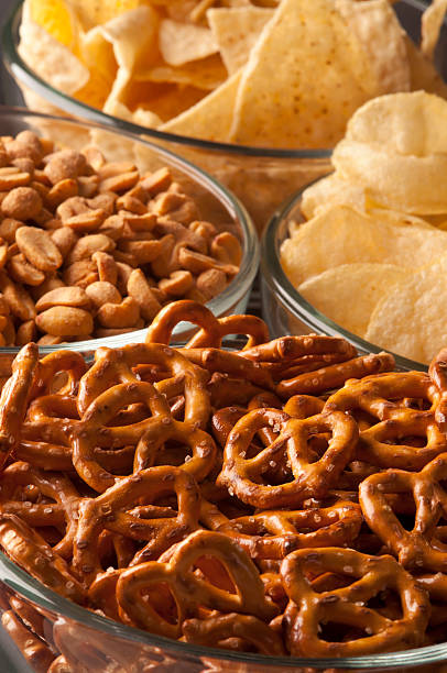 istock Pretzels, chips, and other game day snacks 183889804
