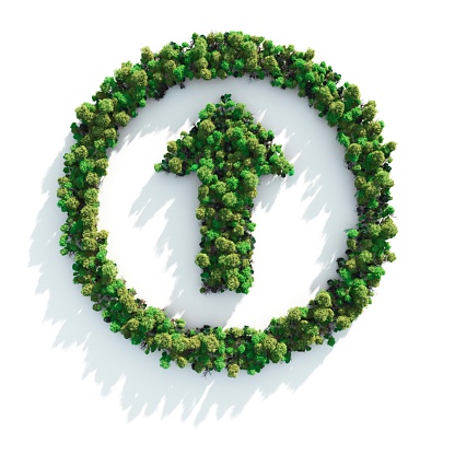 Green recycling symbol on brown creased paper background from a paper packaging. eco-friendly and save the world concept