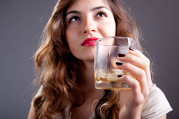 whisky with young women stock photo