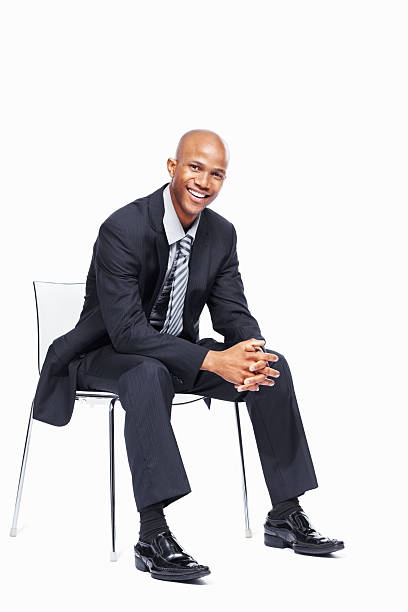 istock Friendly business man sitting in chair 183890528