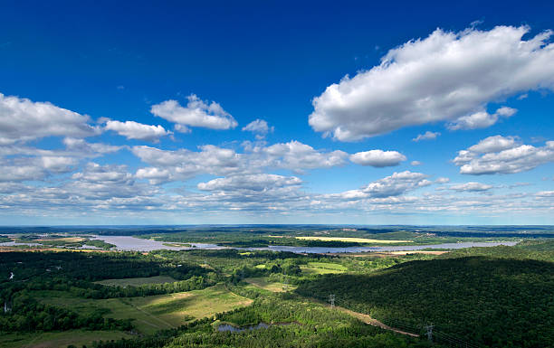 Green Arkansas landscape under a blue cloudy sky The view from the top of Pinnacle Mountain in central Arkansas, USA.  arkansas stock pictures, royalty-free photos & images