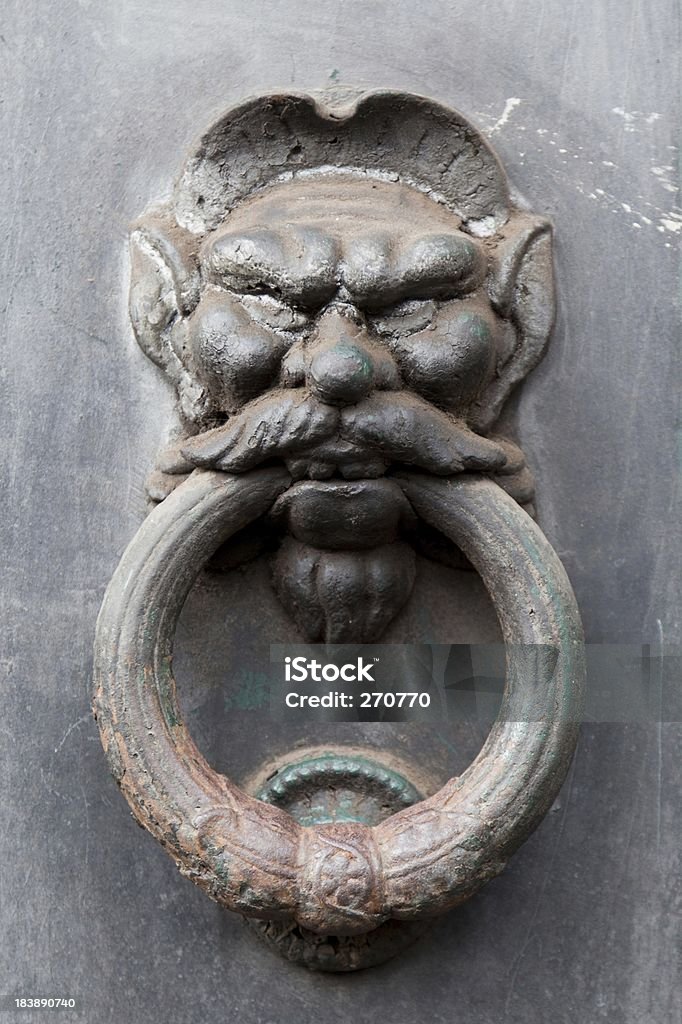 Ancient Roman door Knocker. Rome, Italy Roman door Knocker made from metal Ancient Stock Photo