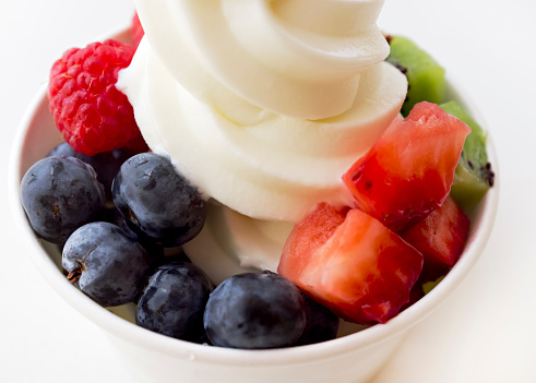 Frozen yogurt and fruit close-up.