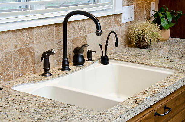 istock Close up kitchen sink with granite counter 183890868
