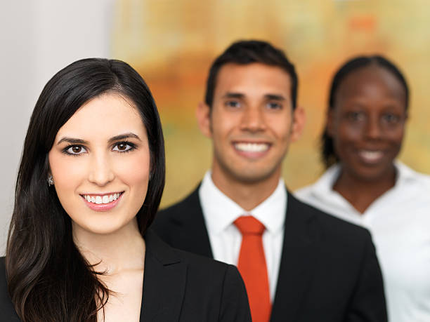 istock Attractive business woman with her team 183890981