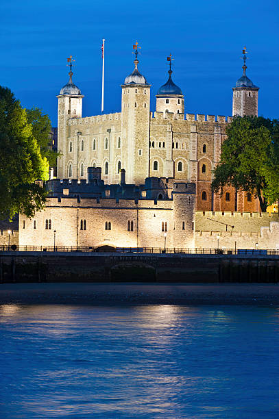 istock Tower of London spotlit at night over River Thames 183890982