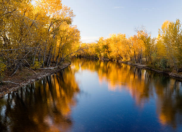 Boise River Autumn "Beautiful autumn reflection along Boise River in Boise, Idaho, USA on a fine autumn evening.Please see my Autumn Landscape lightbox for more Autumn Landscape image options:" boise river stock pictures, royalty-free photos & images