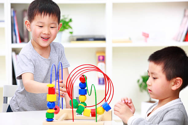 istock two kids playing in home 183891928