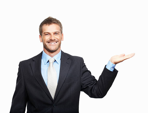 istock Smiling business man holding out his palm 183892296