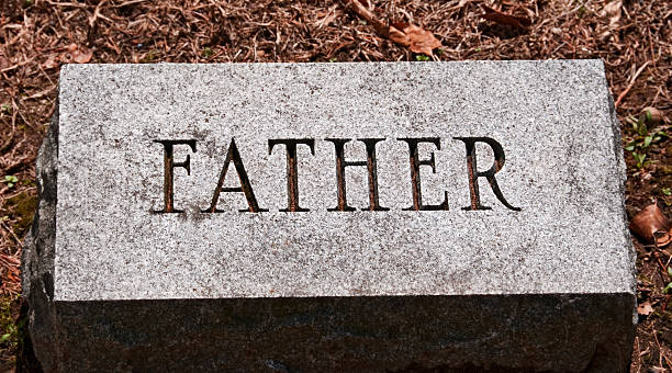 istock Father Gravestone in a Cemetery 183892331