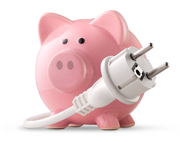 istock Energy saving. Electric plug with piggy bank. 183892410