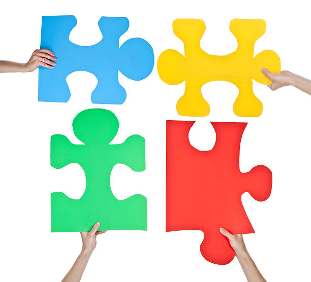 istock Hands Holding Colorful Puzzle Pieces Representing Autism 183892656