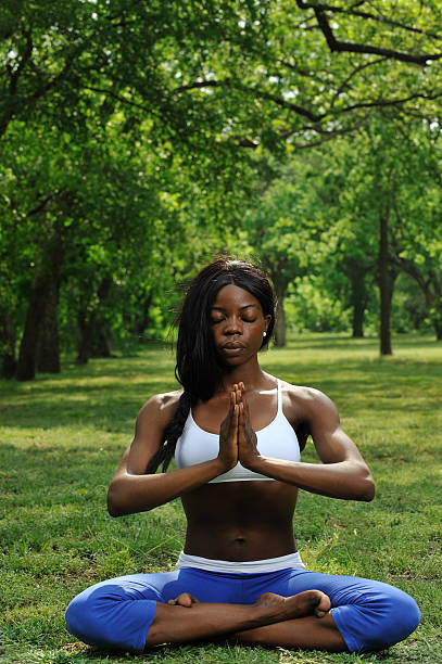 istock Young woman practicing yoga un nature 183892892