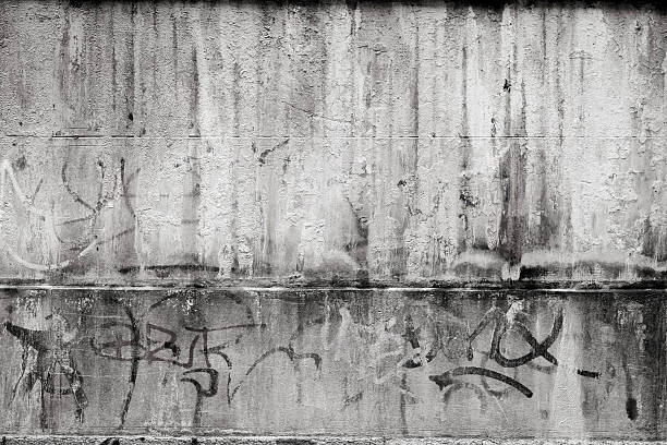 Graffiti wall Grey textured concrete wall with graffiti. graffiti stock pictures, royalty-free photos & images