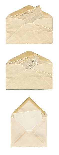 istock Three Very Old and Yellowed Envelopes on a White Background 183893055