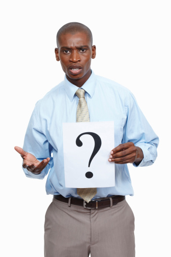 Portrait of business man standing on white background with a question mark sign