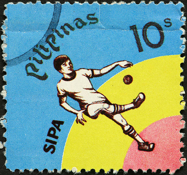 istock boy kicking a small ball on Philippine postage stamp 183893651