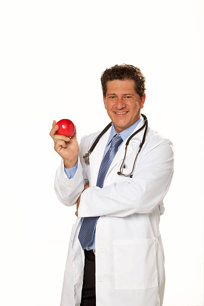 Doctor holding an Apple stock photo