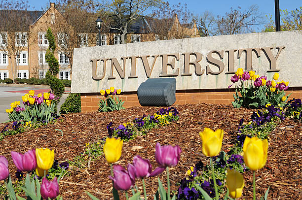 istock University sign with lecture hall and tulips 183893929