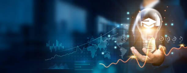 Businessman holding creative light bulb with growth graph and educational technology icons. Pioneering innovation technology revolutionizes new tools and platforms that empower successful learning.