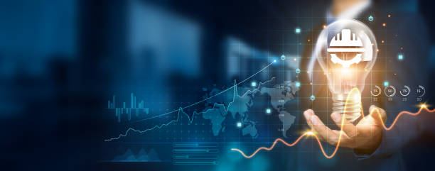 istock Businessman holding creative light bulb with growth graph and engineering icons. Pioneering innovation technology engineers new solutions and advancements that enhance successful and efficiency. 1838941973