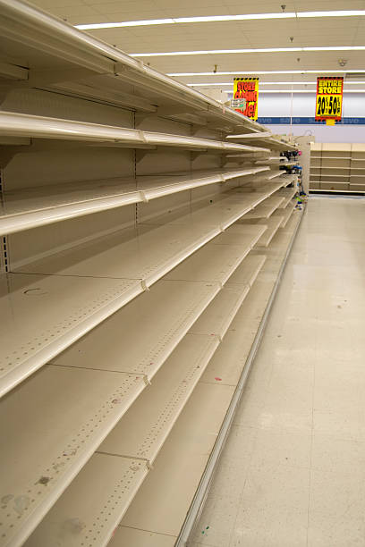 istock Empty store shelves in a grocery store 183894337