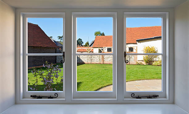 farmhouse window a window set in a farmhouse room with views over a garden area and farm buildings in the background. This is actually no longer a working farm but a series of dwellings.  window latch stock pictures, royalty-free photos & images