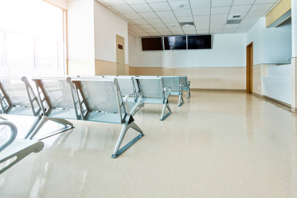 istock Empty seats in hospital waiting room 1838954071