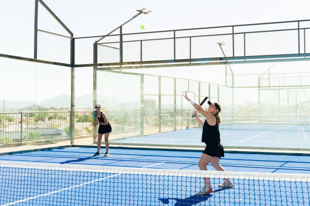 istock Active women doing a padel tennis serve exercising 1838971506