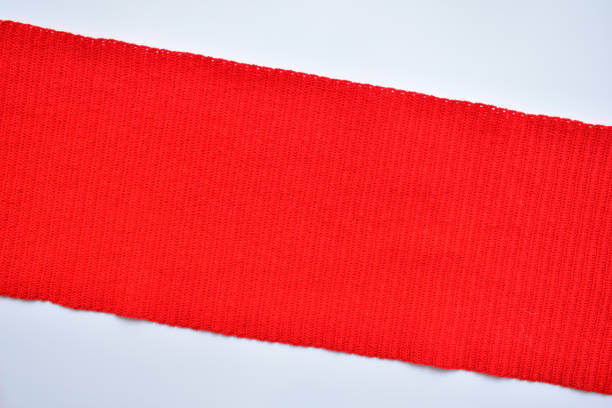 istock red wool knitted yarn texture, woolen fabric on white background 1838976171
