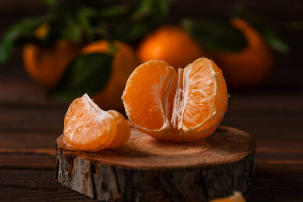istock Tangerines in a plate on a wooden table 1838976692
