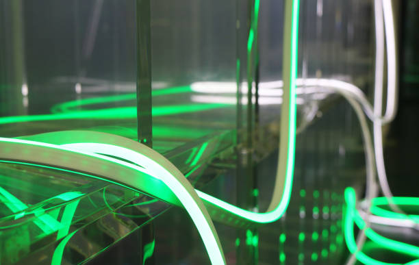 istock Green led neon flexible strip light illuminated background. 1838977595