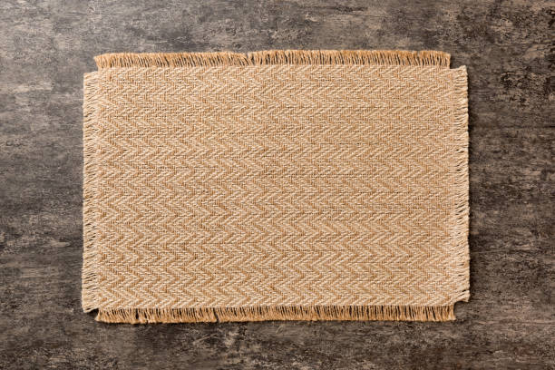 istock Top view of brown tablecloth for food on cement background. Empty space for your design 1838986099