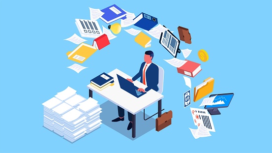 Busy working businessman, dealing with work and paperwork, isometric businessman sitting at a desk working hard to complete an overloaded workload