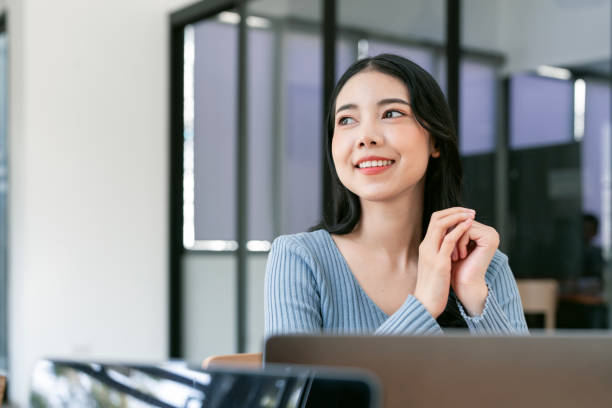 istock Image of young beautiful joyful woman smiling while working with laptop 1839003247