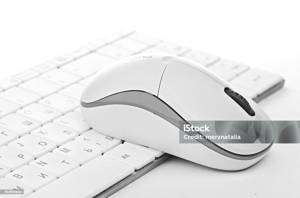 White computer mouse on the keyboard Alphabet Stock Photo