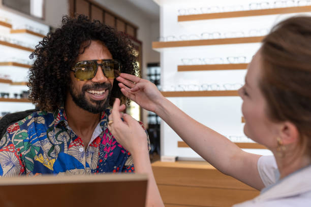 istock A customer buys glasses from an optician 1839023163